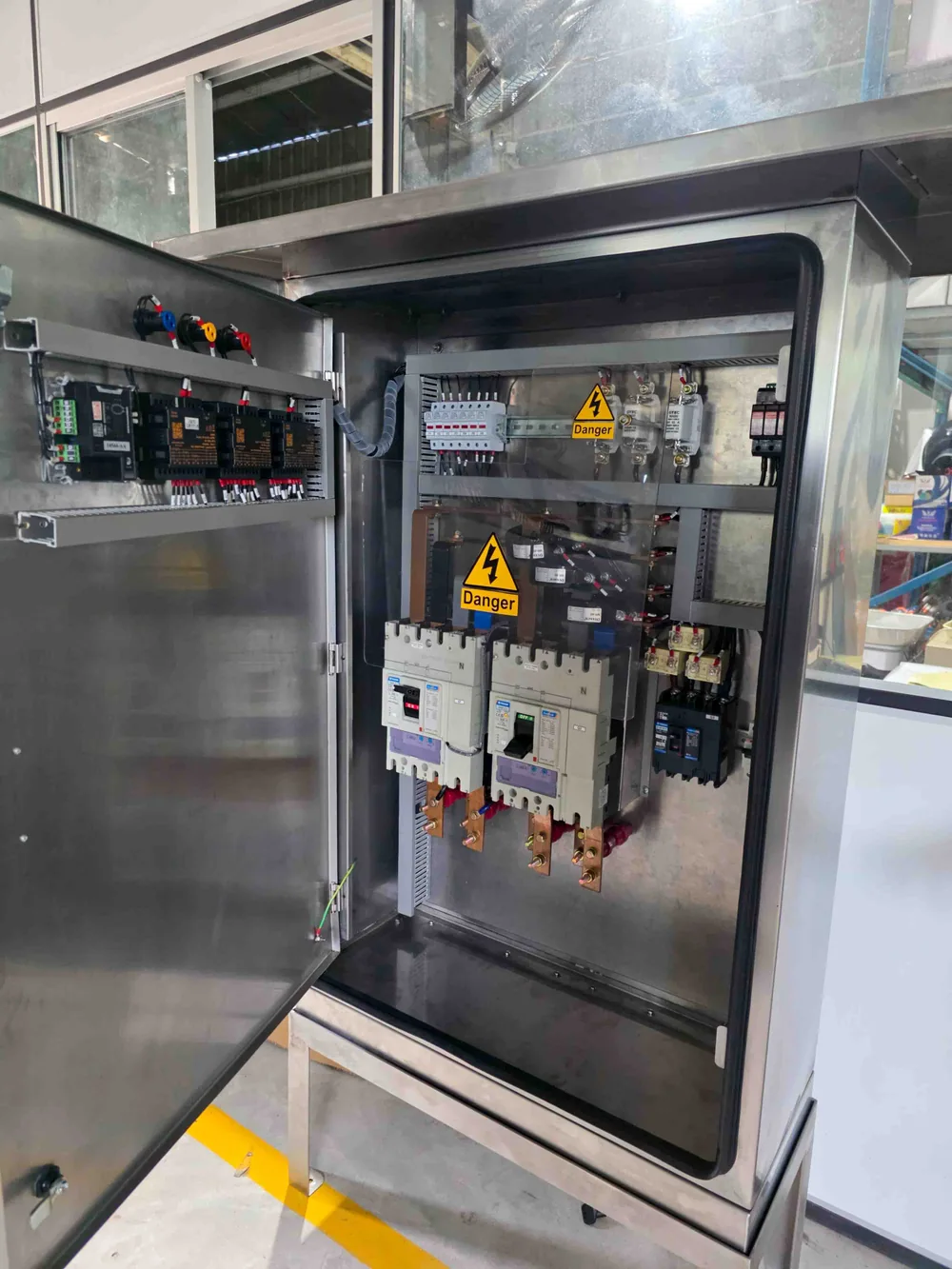 Open Meklet switchgear enclosure with electrical components visible
